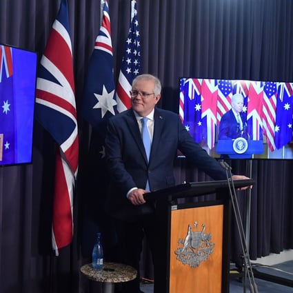Australia’s Prime Minister Scott Morrison (centre), flanked by Britain’s Prime Minister Boris Johnson and US President Joe Biden, at a joint press conference in Canberra. Photo: EPA