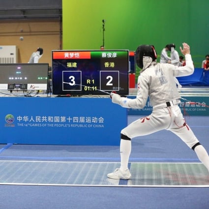 Ryan Choi (right) against Huang Mengkai of Fukien in the team foil semi-finals. Photo: Chinese Fencing Association.