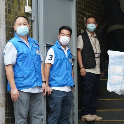 National security police search the group’s warehouse on Monday. Photo: Felix Wong