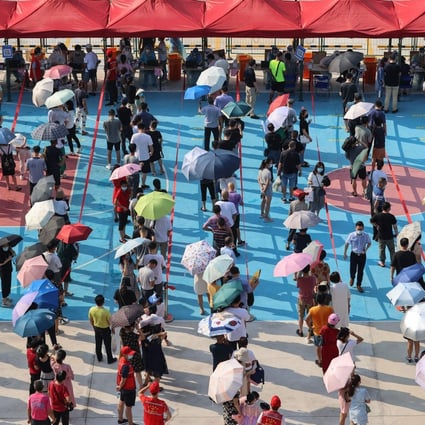Residents of Xiamen in China’s Fujian province queue for mass Covid-19 testing. Photo: AFP