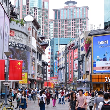 Shoppers and visitors crowd the famous Dongmen Pedestrian Street in Shenzhen. Photo: Shutterstock