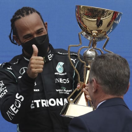 British Formula One driver Lewis Hamilton celebrates on the podium after the 2021 Formula One Grand Prix at the Sochi Autodrome racetrack in Sochi, Russia on Sunday. Photo: EPA-EFE