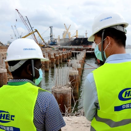 Engineers from China and Tanzania are pictured at the construction site of the Dar es Salaam Port upgrade in Tanzania. A report by AidData says China spent an average US$85.4 billion a year in the five years after the Belt and Road Initiative was launched in 2013. Photo: Xinhua
