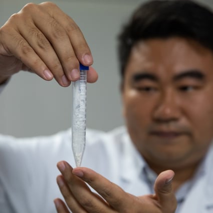 Scientist Cai Tao shows a sample of synthesised starch at a lab earlier this month. Photo: Xinhua