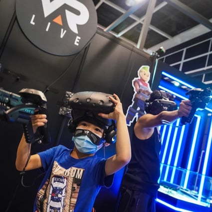 Children play with virtual reality headsets at the Hong Kong Animation-Comics & Games Expo on July 23, 2021. Photo: Felix Wong