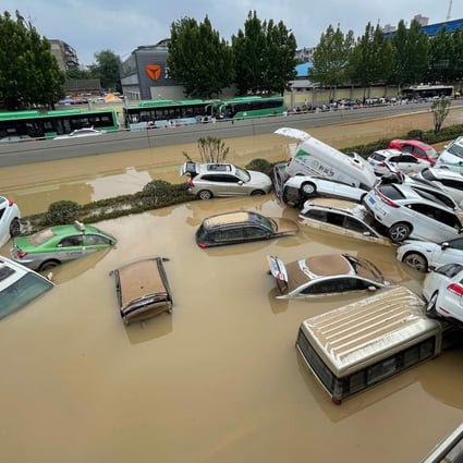 Cars submerged in floodwaters after heavy rains hit the city of Zhengzhou in China’s central Henan province. Photo: AFP