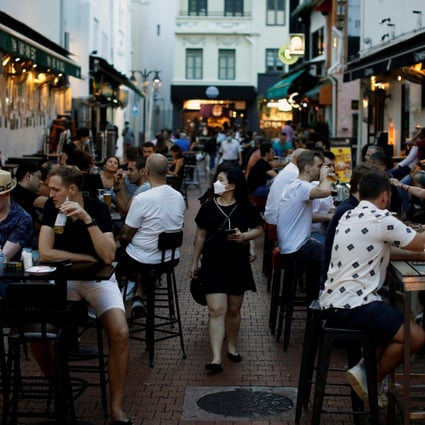 People dine at Boat Quay in Singapore. Photo: Reuters