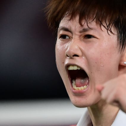 China's Chen Yufei reacts after a point with Taiwan's Tai Tzu-ying in their women's singles badminton final match during the Tokyo 2020 Olympic Games. Photo: AFP