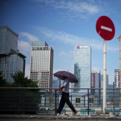 The headquarters of China Evergrande Group, centre, in Shenzhen. The developer was downgraded in three steps during the third quarter by Fitch because of its liquidity crisis. Photo: Reuters