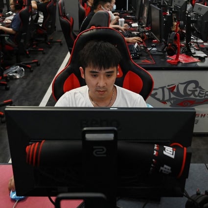 People play computer games at an internet cafe in Beijing on September 10, 2021, days after Chinese officials summoned gaming enterprises including Tencent and NetEase to discuss further curbs on the industry. Photo: AFP