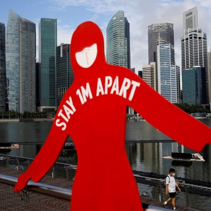 A sign to encourage social distancing in Singapore. Photo: Reuters