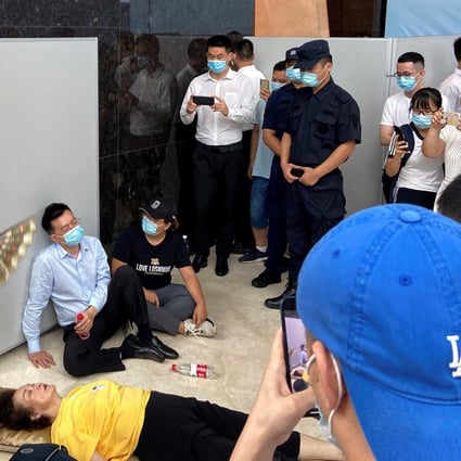 Customers of China Evergrande Group’s wealth management financial products staged a protest at the company’s Shenzhen head office on September 14, 2021 to demand their money back, amid concerns over the company’s financial health. Photo: Reuters.