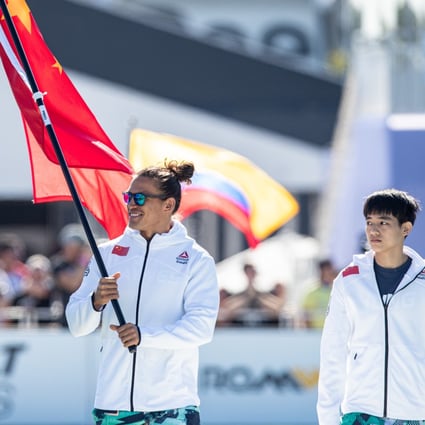 Hong Kong’s Ant Haynes carrying the Chinese flag and Taiwan’s Ruei Hung Tsai-jui during the opening ceremony of the 2019 CrossFit Games. Photo: CrossFit Games