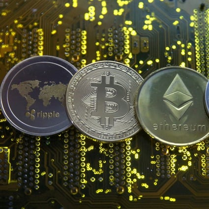 Representations of the Ripple, bitcoin, ether and Litecoin virtual currencies seen on a PC motherboard on February 14, 2018. China’s crackdown on cryptocurrency mining has effectively pushed out nearly all related operations, sending its portion of the bitcoin hash rate to zero as the US becomes the top market at 35 per cent. Photo: Reuters