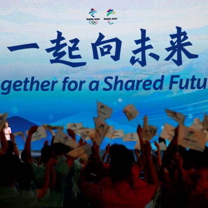 The slogan for the Beijing 2022 Winter Olympics, ‘Together for a shared future’, is unveiled on a giant screen at a ceremony in Beijing, China on September 17, 2021. Photo: Reuters