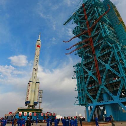 A Long March 2F carrier rocket, carrying the Shenzhou 13 spacecraft, at the Jiuquan satellite launch centre in China. Photo: AFP