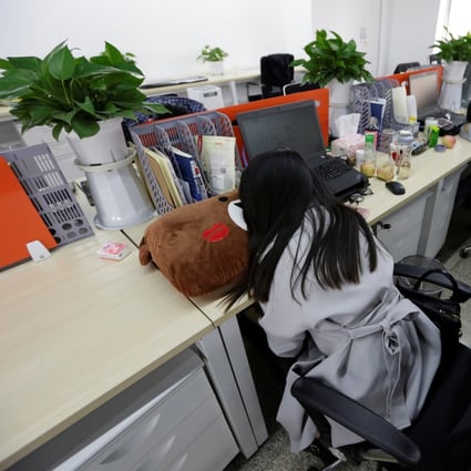 Employees at a fintech startup in Beijing take a rest at work. Photo: Reuters