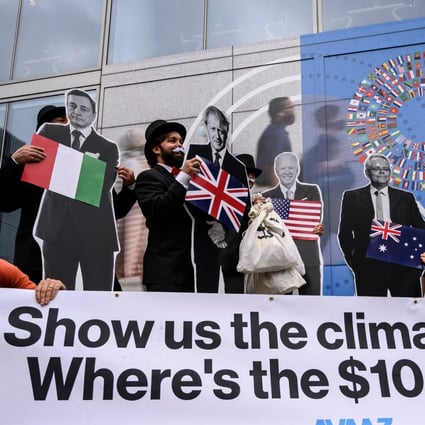 Activists demonstrate in front of the IMF headquarters in Washington on October 13, as they urged rich nations to keep their commitment to help tackle climate change. Photo: AFP