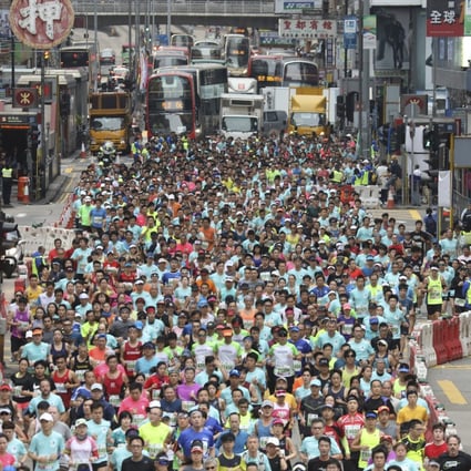 The 2021 Standard Chartered Hong Kong Marathon will be the first mass participatory sports events since coronavirus hit Hong Kong last year. Runners are pictured at the start in Tsim Sha Tsui’s Nathan Road ahead of the 2019 event. Photo: Dickson Lee
