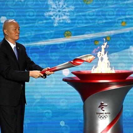 Cai Qi, the Communist Party secretary of Beijing, lights the Olympic cauldron in Beijing after the flame’s arrival on Wednesday. Photo: AFP