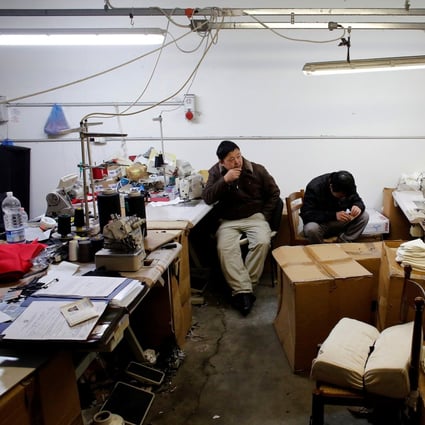Chinese immigrant workers at a textile factory in Prato, Italy in 2013. The government’s Green Pass is preventing many Chinese from going to work. File photo: Reuters