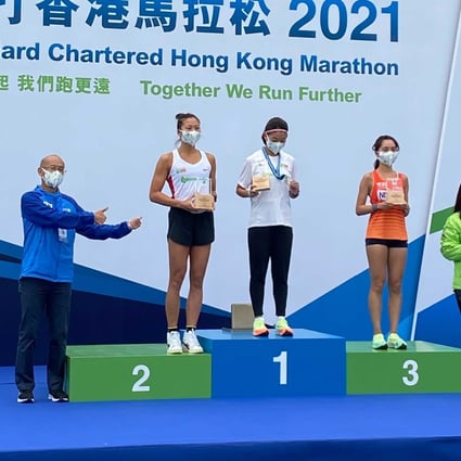 Distance runner Virginia Lo Ying-chiu tops the women’s 10km podium at the 2021 Standard Chartered Hong Kong Marathon ahead of second placed Hilda Choi Yan-yin. Photo: Andrew McNicol