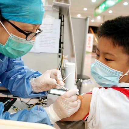 China has been vaccinating children aged 12 and older, and now governments in at least five provinces have said those aged three to 11 will need to get the jab. Photo: Xinhua