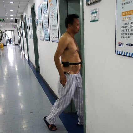 A patient walks into a ward at a diabetes hospital in Beijing. The disease in China is most common among the wealthy. Photo: AFP