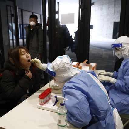 A member of the media is tested for the Covid-19 at an Olympic test event in China. Photo: Reuters