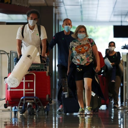 Passengers from Amsterdam arrive at Changi Airport on October 20, 2021. Photo: Reuters