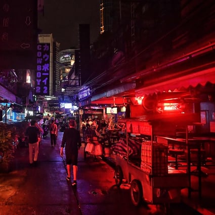 Bangkok’s Soi Cowboy area after bars were allowed to open with tight restrictions on alcohol sales. Industry players fear many of the independent bars and clubs that give the city its character will close. Photo: AFP