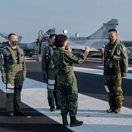 Taiwan officials have downplayed remarks by President Tsai Ing-wen (centre) confirming the presence of US military personnel on the island. Photo: AP