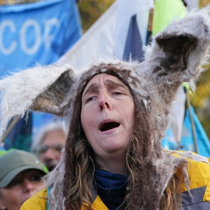 A woman takes part in a protest on Saturday to ask delegates to make bottom trawling/dredging a thing of the past, ahead of the COP26 climate conference in Glasgow, Scotland Photo: PA / DPA