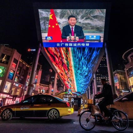 President Xi Jinping’s address to world leaders at the G20 summit on Sunday is shown on a screen at a Beijing shopping centre. The meeting was a prelude to COP26 in Glasgow. Photo: Reuters