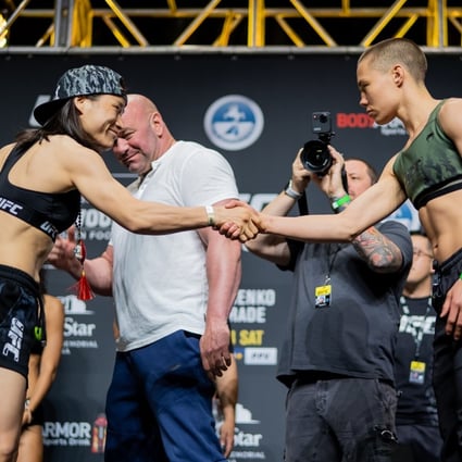 Zhang Weili and Rose Namajunas shake hands at the UFC 261 weigh-in. Photo: Zuffa LLC