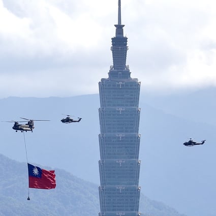 A Chinook and Apache helicopters fly past the Taipei 101 tower in Taiwan. Photo: EPA