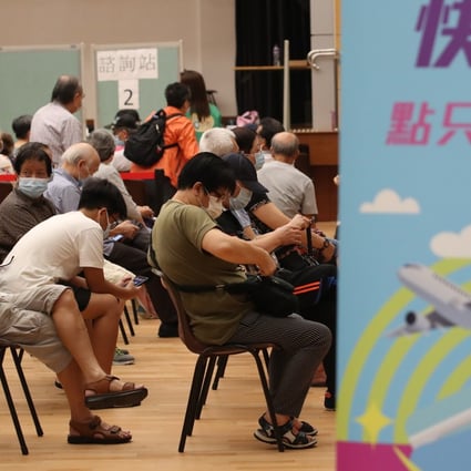 Residents, mostly the elderly, wait at Shek Lei Community Hall for their Sinovac shots under a government outreach programme. Photo: Edmond So