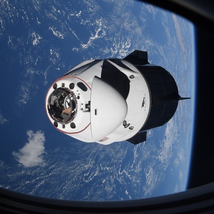 The SpaceX Crew Dragon capsule approaches the International Space Station for docking in April. Photo: Nasa via AP