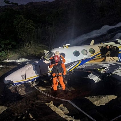 The plane carrying Brazilian singer Marilia Mendonca and four others is seen at the crash site in Caratinga, Brazil on Friday. Photo: Minas Gerais Fire Department via EPA-EFE