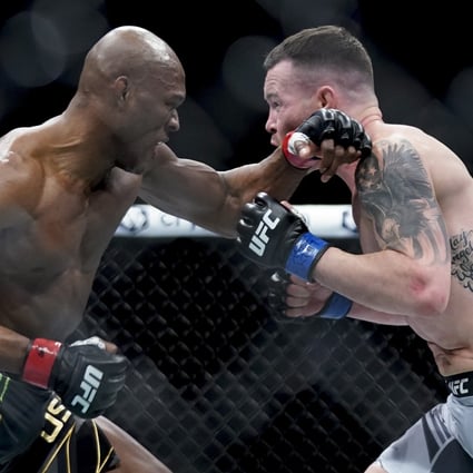 Kamaru Usman (left) exchanges punches with Colby Covington during their welterweight title fight at UFC 268. Photo: AP
