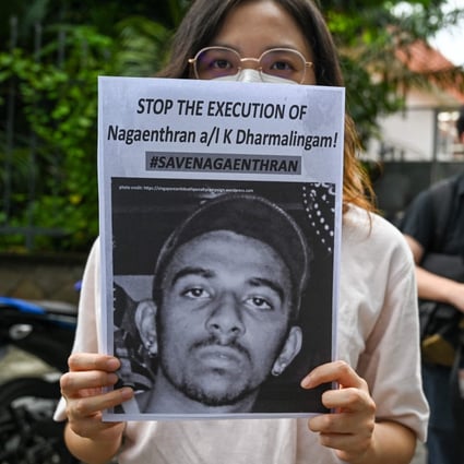 Activists hold placards to urge Singapore to stop the execution of Nagaenthran K. Dharmalingam on November 3, 2021. Photo: AFP