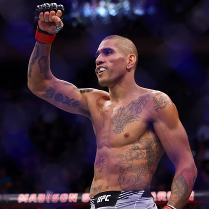Alex Pereira celebrates after his TKO victory against Andreas Michailidis in their middleweight bout at UFC 268. Photos: AFP