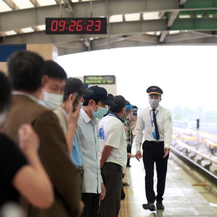 People wait for a train on the Cat Linh-Ha Dong line in Hanoi. Photo: EPA-EFE