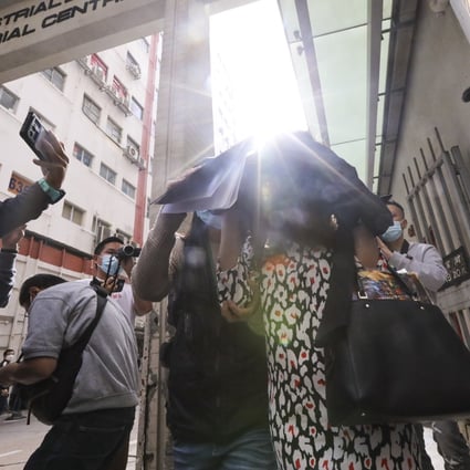 Customs officers escort a suspect out of a building on Shing Yip Street, in Kwun Tong. Photo: Felix Wong