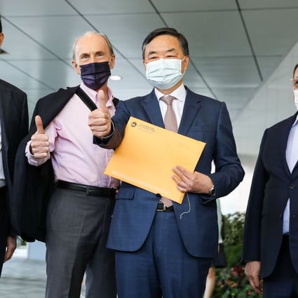 Louis Loong (second from right), secretary general of the Real Estate Developers Association, meets the media before signing up for the Legco race. Photo: Edmond So