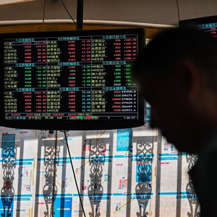 Stock price movements are seen on screens at a securities company in Shanghai. Chinese and Hong Kong stocks rose on Thursday. Photo: AFP