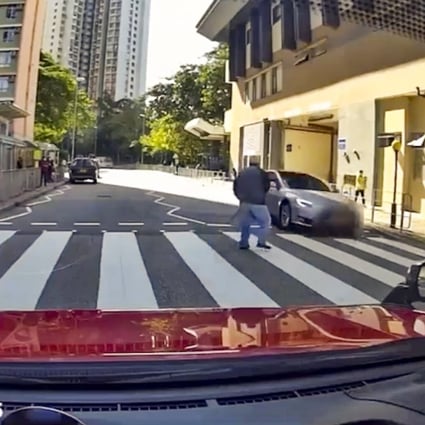 Dashcam footage shows how close a fast-moving Tesla passed by an elderly pedestrian on Wednesday. Photo: Facebook