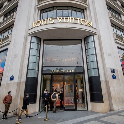 People seen outside a Louis Vuitton store on the Champs Elysees Avenue in Paris on May 11, 2020. Photo: Xinhua