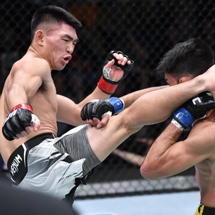 Song Yadong connects with a kick to the head of Julio Arce during their bantamweight fight in Las Vegas. Photo: Zuffa LLC)