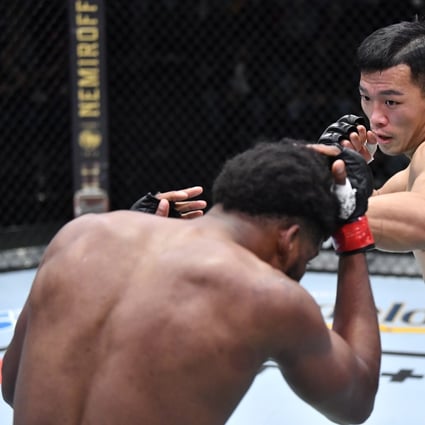 Da-un Jung punches Kennedy Nzechukwu during their light heavyweight fight in Las Vegas. Photo: Zuffa LLC